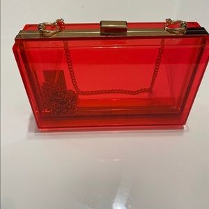Red PVC clutch with chain